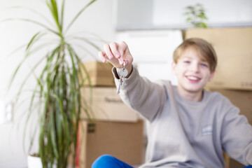 Happy Child Holding Keys in New Home