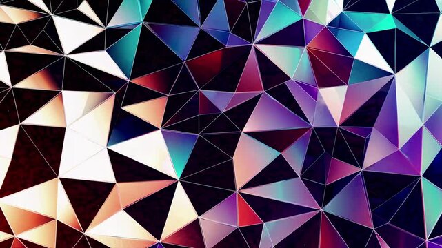 Abstract geometric pattern with vibrant colors and triangular shapes. Top-down angle creates a dynamic video background effect.
