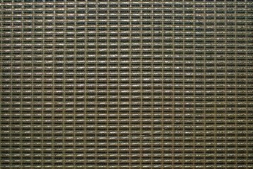 Close-up of the mesh material from a guitar amp.