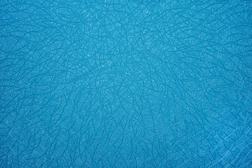 Close-up of blue background with chaotic texture.