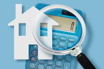 MORTGAGE LOAN CALCULATION WITH HOUSE SHAPE CALCULATOR AND MAGNIFIER - Financial concept for property, home, real estate budget, price, cost, value, tax and interest rate analysis for buying or selling