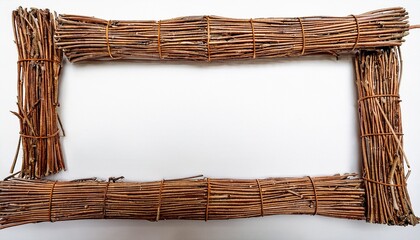rectangular frame made of small brown and tan twigs horizontally and vertically arranged with a white background