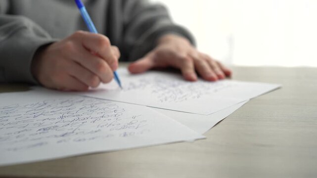 Writing a script at a desk in an office.
A man writes with a pen on a white sheet of paper.
A copy editor writes with a pen in an office.
A man writes a text on paper.
Text, script, documents, editor,