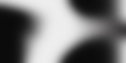 Abstract black and white textured background with soft gradients and subtle grain effect