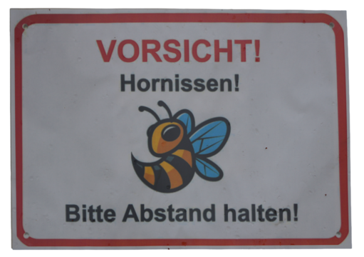 a warning sign with a cute cartoon bee and german text about hornets and keeping distance