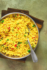 rice with saffron and vegetables, in a frying pan, top view, homemade, no people,