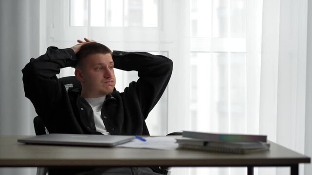 Difficulties at work.
A businessman throws papers around the office in anger.
Stress and fatigue at work.
An angry office worker at his desk with papers and documents.