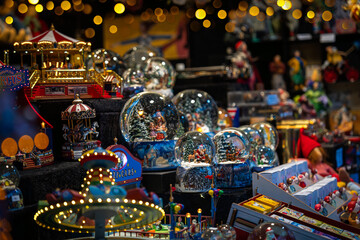 Switzerland, Basel 1.11.25; A snow globe. Christmas market in Europe. The showcase of the store of...