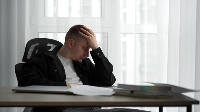 Work fatigue.
Angry outbursts and problems with documents.
Paperwork and problems in the office.
Conflict and stress.
A person is tired of working in the office and is looking forward to the day off.