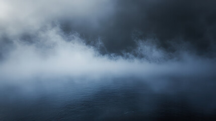 Fototapeta premium Mist over dark water creating mysterious atmosphere with cloudy sky above