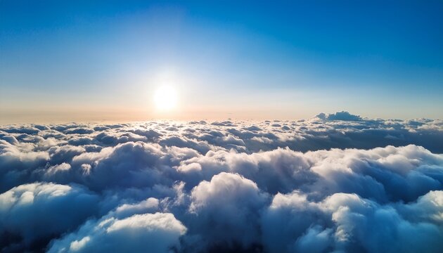 a breathtaking aerial view of a sea of clouds under a bright blue sky with the sun shining through creating a serene and dreamy atmosphere - Powered by Adobe
