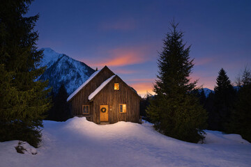 house in the mountains at sunset