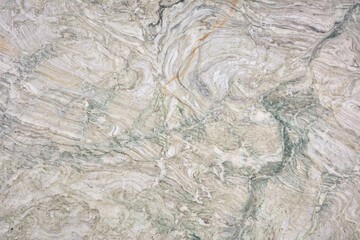 Intricate swirls and patterns of natural stone create a unique textured surface