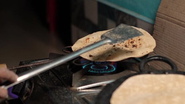 Indian Flatbread Making by a Women. Roti or chapati making.  Indian bread.