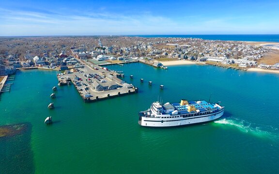 Aerial of the Nantucket Ferry Arrives from Woods Hole, Cape Cod with Tourists and Vacationers