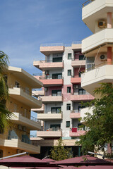 A two-tone residence with palm trees nearby brings a semi-tropical touch to the street. Perfect for long-term rentals, real estate listings, and property investors abroad.