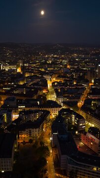 night illumination zurich city center traffic streets aerial panorama 4k vertical timelapse switzerland