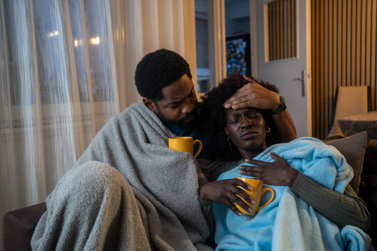 Sick couple catch cold. Man and woman sneezing, coughing, got flu, having runny nose.