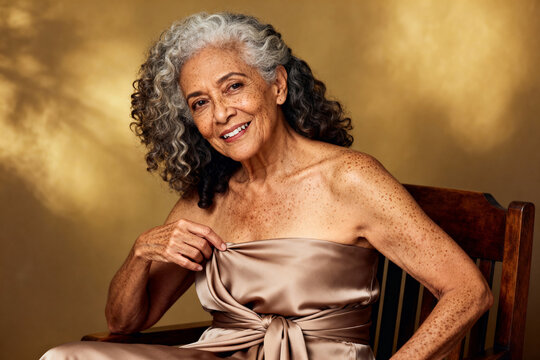 A sophisticated older woman exudes calm and grace as she poses in elegant attire. Elderly elegance concept