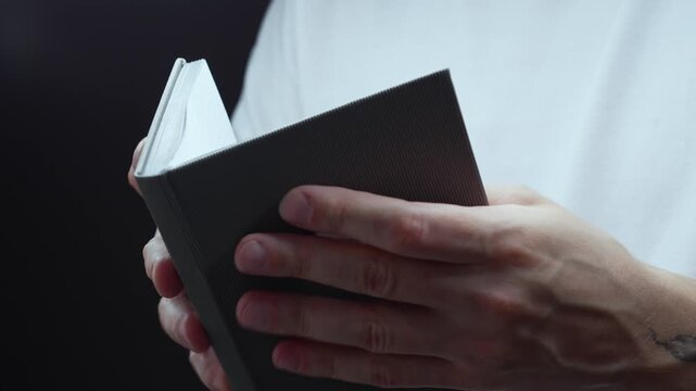 Religion and culture.
Reading a prayer from the Bible.
A Christian with a Bible in his hands reads a prayer.
God, church, prayer, book, Jesus, Christian