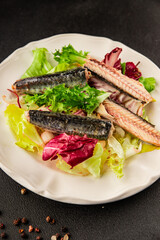 Mackerel salad canned fish, lettuce leaves tasty snack fresh delicious gourmet food table setting rustic food top view copy space keto and paleo diet vegetarian and vegan food pescetarian diet