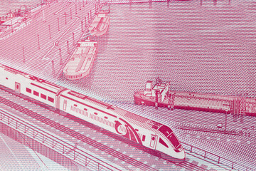 Extreme Macro Detail of New Polymer One Hundred UAE Dirham Banknote Showing High-Speed Train and Port Infrastructure