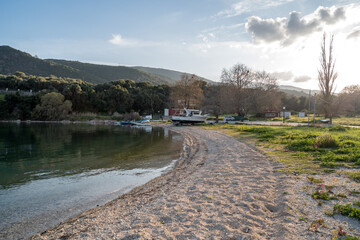 Sunset Beach with Boats in Loutraki, Greece
