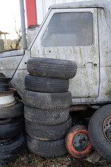 Metal dump, waste collection, recycling, old dirty car and old tires