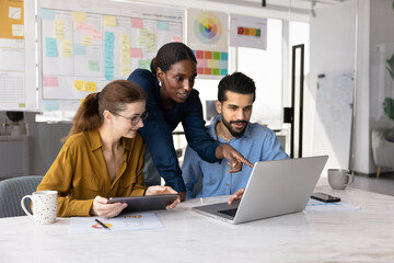 Team of positive busy diverse professionals watching promo media content