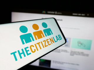 Fototapeta premium Stuttgart, Germany - 11-19-2025: Smartphone with logo of Canadian research laboratory Citizen Lab on screen in front of website. Focus on center of phone display.