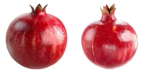 Two vibrant red pomegranates stand in the sun. This shot of the fruit presents its color and the beauty of the shape. 