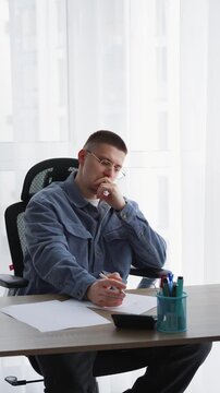 Journalism and paperwork.
A man works in an office and signs important documents.
An editor corrects text on a white sheet of paper.
Calligraphy and handwriting