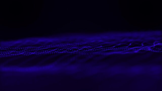 Blue abstract wave of glowing dots on dark background. Futuristic digital landscape with depth of field. Technology particle terrain for sci-fi, background design, motion or data projects - Powered by Adobe