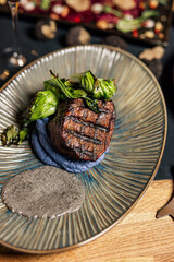 Gourmet grilled beef steak served with colorful puree
Premium steak medallion plated with greens and edible flower
Fine dining beef steak presented as an upscale entrée