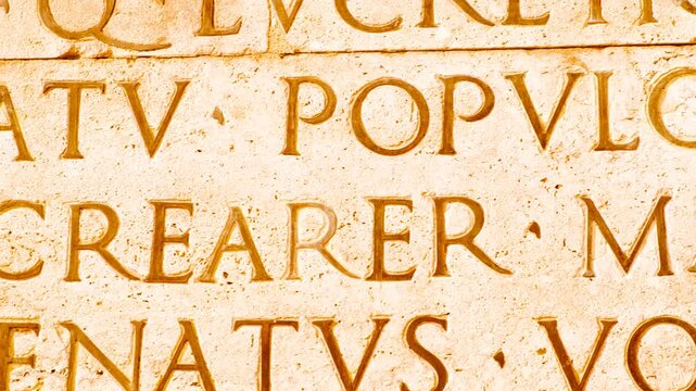 Latin inscription of the Res Gestae Divi Augusti The Deeds of the Divine Augustus written by Emperor Augustus in Rome, Italy