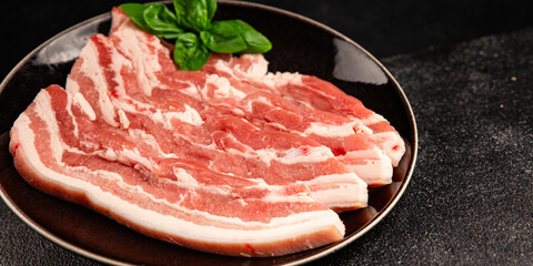 Bacon slice lard with meat slices pieces pork tenderloin portion size natural product tasty snack fresh delicious gourmet food background on the table rustic top view copy space