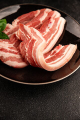 Bacon slice lard with meat slices pieces pork tenderloin portion size natural product tasty snack fresh delicious gourmet food background on the table rustic top view copy space