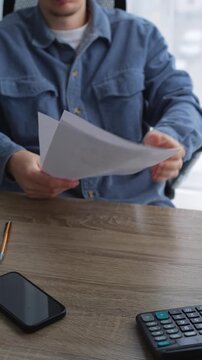 A boss reads resumes of job candidates.
Office recruitment.
Resumes and vacancies.
Business and employment concepts.
Job, office, personnel, department, selection, candidate