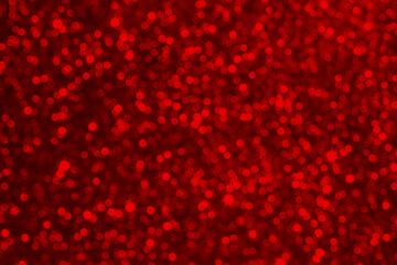 Red glitter bokeh background with festive glow for celebrations, parties, and decorative visuals