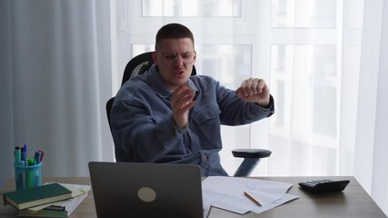 A joyful businessman dances in his office after closing a lucrative deal with a client.
Promotion and success at work.
A businessman's emotions after signing a contract.