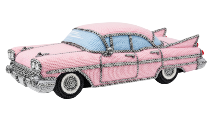 Crocheted pink American sedan modeled in the vintage style of the late 1950s displayed on a transparent background