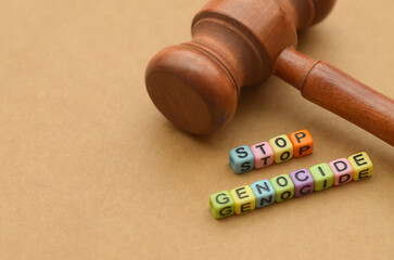 Beaded Call for Justice: 'STOP GENOCIDE' Bracelet Juxtaposed with Legal Authority for Humanitarian Action and Crisis Prevention.