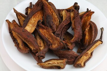 Dried pears arranged on a white plate ready for snacking