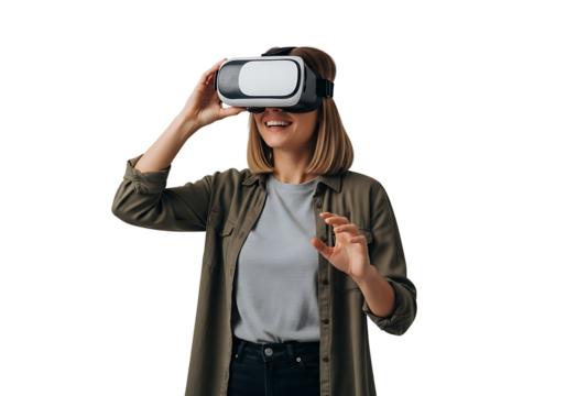 A young woman with blonde hair smiles joyfully while immersed in a VR experience, wearing a white and black headset. Casually dressed in green and grey, she actively gestures, reaching into the virtua