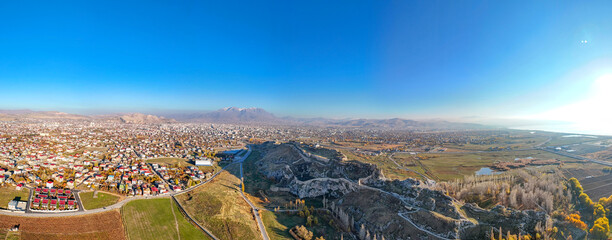Panoramic view of Van Castle (Van Kalesi) and the surrounding city, dramatically situated atop a...