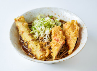 Japanese soba noodles with crispy crab stick tempura. A delightful fusion of textures and tastes, perfect for a nourishing meal.