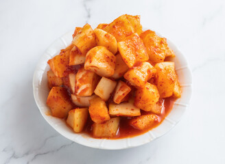 Spicy Korean radish kimchi cubes. A delicious side dish, perfect as an ingredient for meal prep or adding a gourmet touch to your next dish