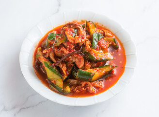 Oi Muchim cucumber scallop salad, a Korean culinary delight that's both spicy and refreshingly healthy.