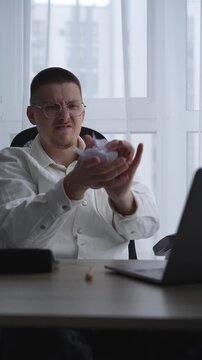 An angry businessman scatters torn and wrinkled paper around the office.
A man is having problems at work.
A man has a nervous breakdown at work and tears up paper.
Paper, stress, nerves, emotions