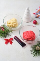 Step-by-step preparation of Candy Cane shortbread cookies in Christmas decor on a light concrete background. Merry Christmas! Traditional Christmas treats